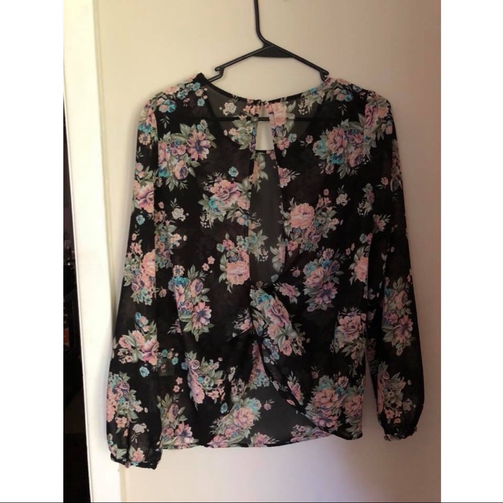 Black floral top with twist back.